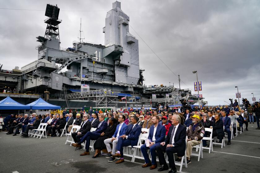 San Diego, CA - April 25: The public attending groundbreaking ceremony to kick off the construction of Freedom Park at Navy Pier next to the USS Midway Museum on Thursday, April 25, 2024 in San Diego, CA. This multi-year joint project between Midway and the Port of San Diego will construct the largest veterans park on the West Coast. Rep Scott Peters (2nd from left), Terry Kraft (4th from left) and Mayor Todd Gloria (5th from left) were among the officials taking part. (Nelvin C. Cepeda / The San Diego Union-Tribune)