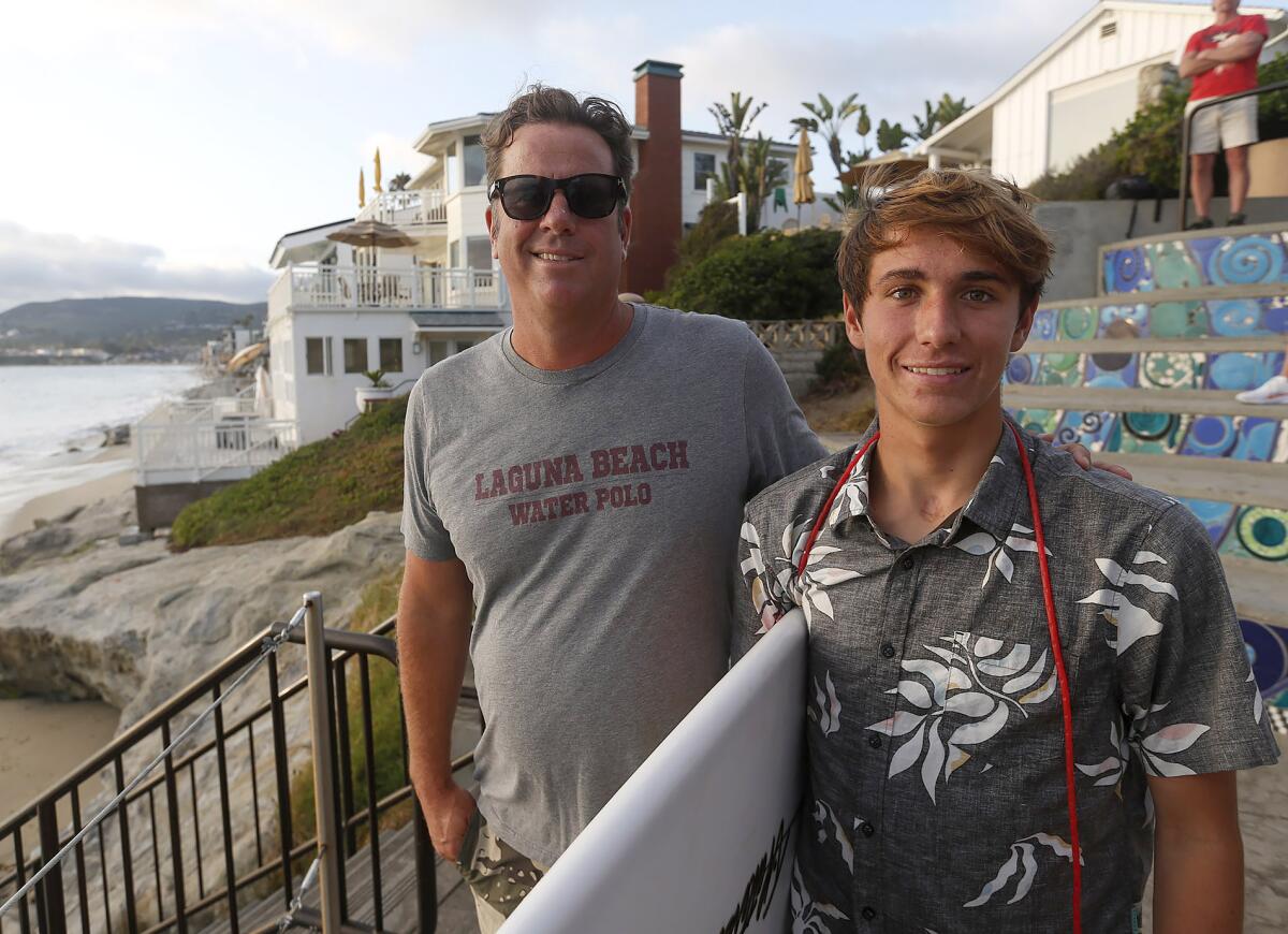Brayden Belden stands with his father, Matt, at Brooks Street in Laguna Beach on Thursday.