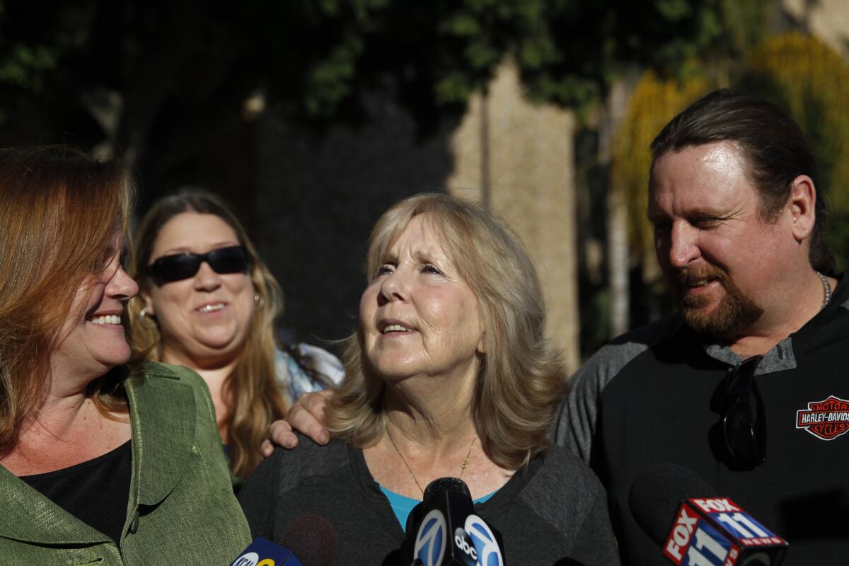 Susan Mellen speaks to the media last year as her attorney, Deirdre O'Connor, left, of Innocence Matters, Christy Kelly, second from left, and nephew, David Mellen, right, listen, after a judge determined she was factually innocent of a 1998 murder.