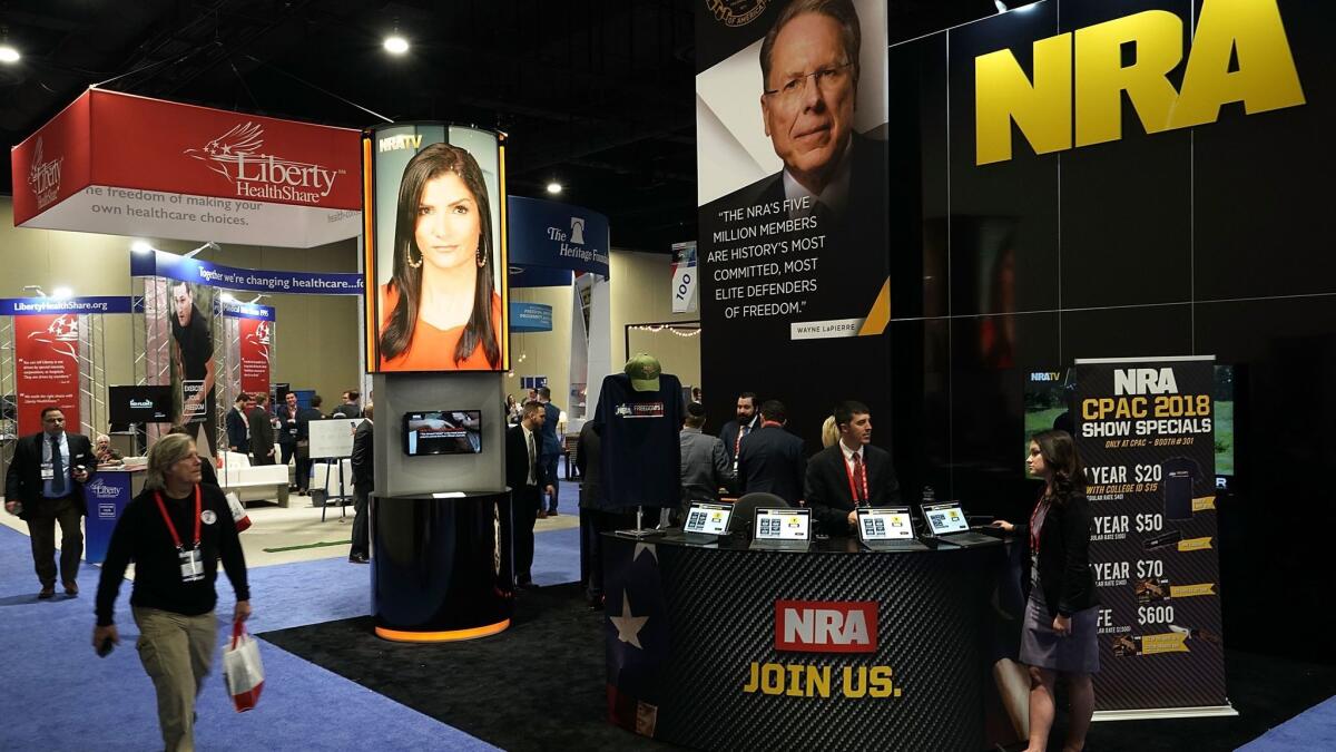 A Burbank woman writes that the NRA should be dismantled. Above, an NRA booth photographed Feb. 22 in National Harbor, Md, where the American Conservative Union hosted its annual Conservative Political Action Conference the week after the deadly Parkland, Fla. shootings.