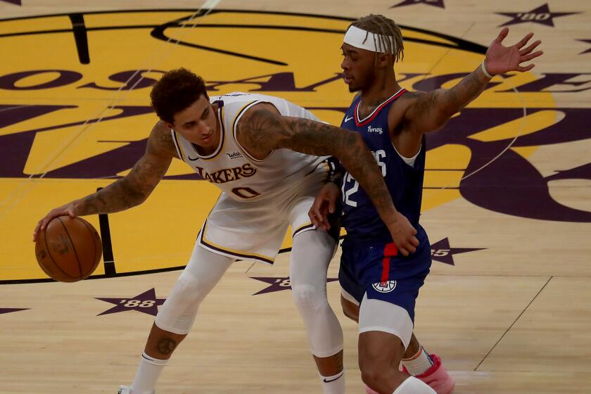 LOS ANGELES,, CALIF. - DEC. 13, 2020. Lakers forward Kyle Kuzma works to the basket.