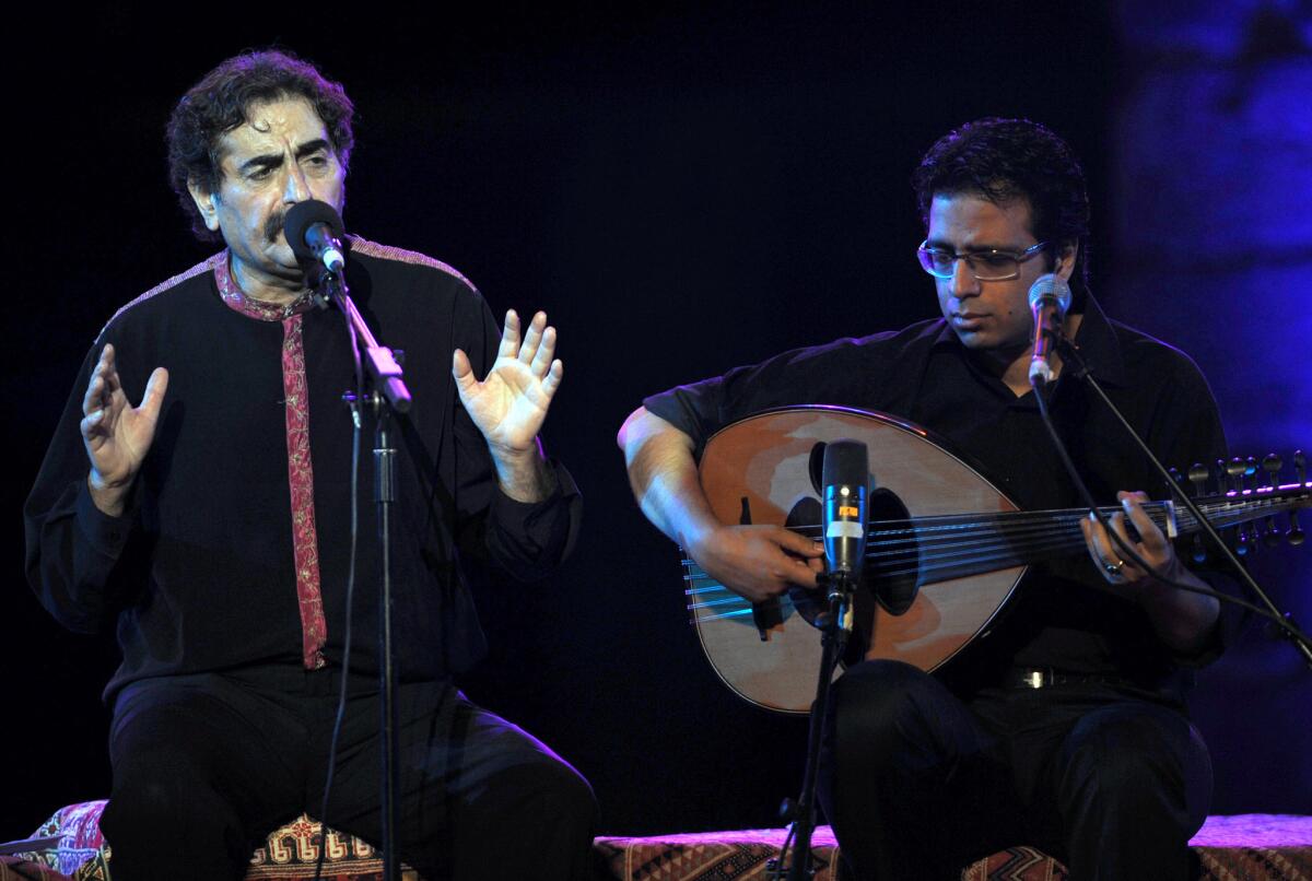 Iranian singer Shahram Nazeri, left, performs at the International Festival of Carthage in Tunisia in 2010.