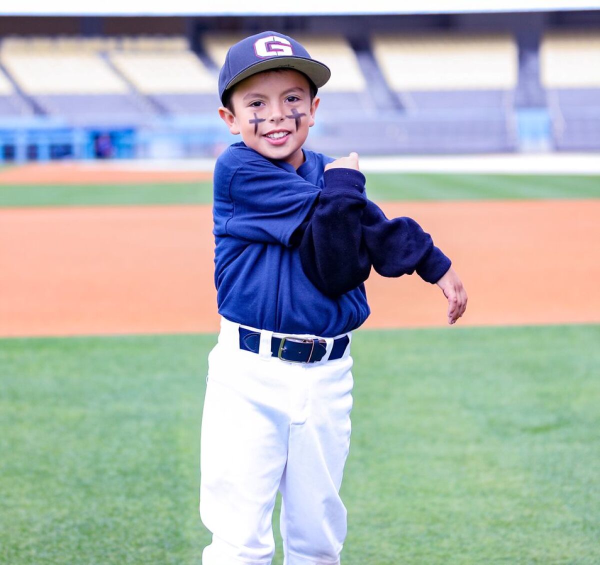 Evan Torres, the 8-year-old son of Garfield coach Ruben Torres, got to work out with players at Dodger Stadium on Saturday.