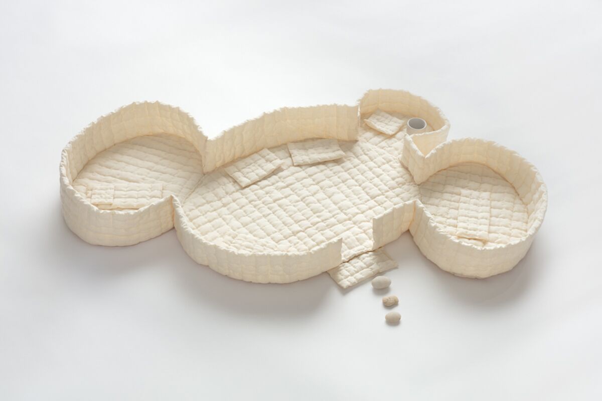 An architectural model for a structure with rounded walls.