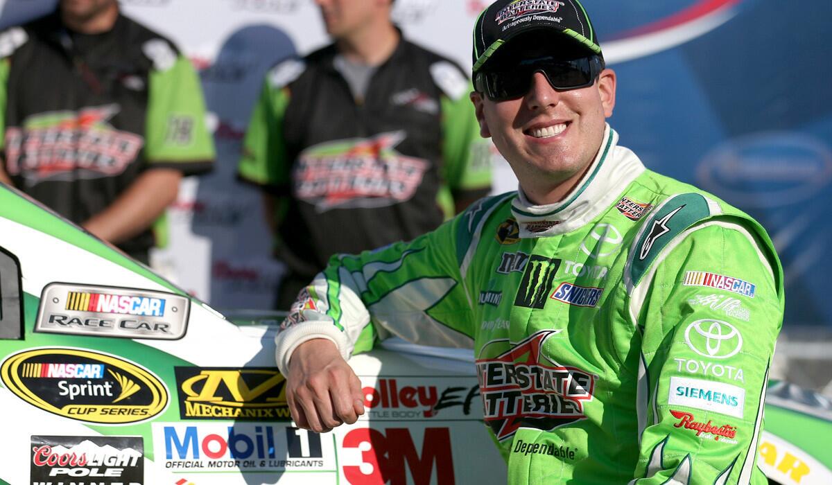 NASCAR driver Kyle Busch was all smiles Friday after qualifying first for the Sprint Cup race at New Hampshire Motor Speedway.