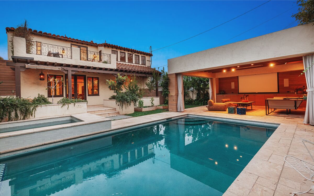 Built in 1932, the home includes a backyard with a pool and cabana surrounded by vegetable gardens and fruit trees.