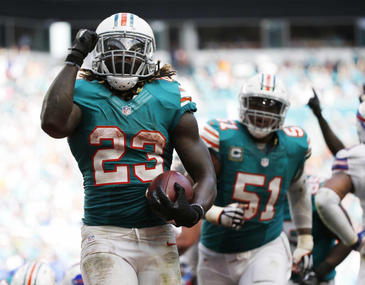 Miami Dolphins running back Jay Ajayi (23) celebrates a touchdown during the second half against the Buffalo Bills on Oct. 23.