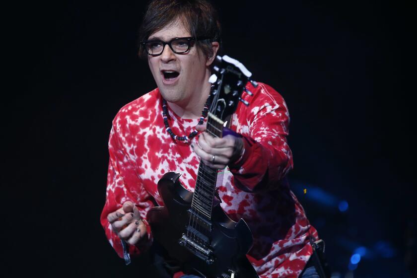 INDIO, CALIF. - APRIL 13, 2019. Rivers Cuomo fronts the Los Angeles rock band Weezer during a performance on the Main Stage on day two of the Coachella Music And Arts Festival at the Empire Polo Grounds in Indio on Saturday, April 13, 2019. (Luis Sinco/Los Angeles Times)