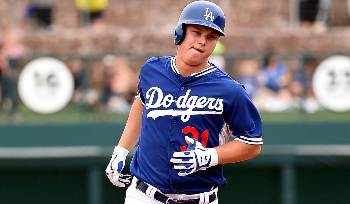 Dodgers center fielder Joc Pederson, shown rounding the bases against the Cubs on March 18, hits his fifth home run of the spring on Saturday against the Angels.
