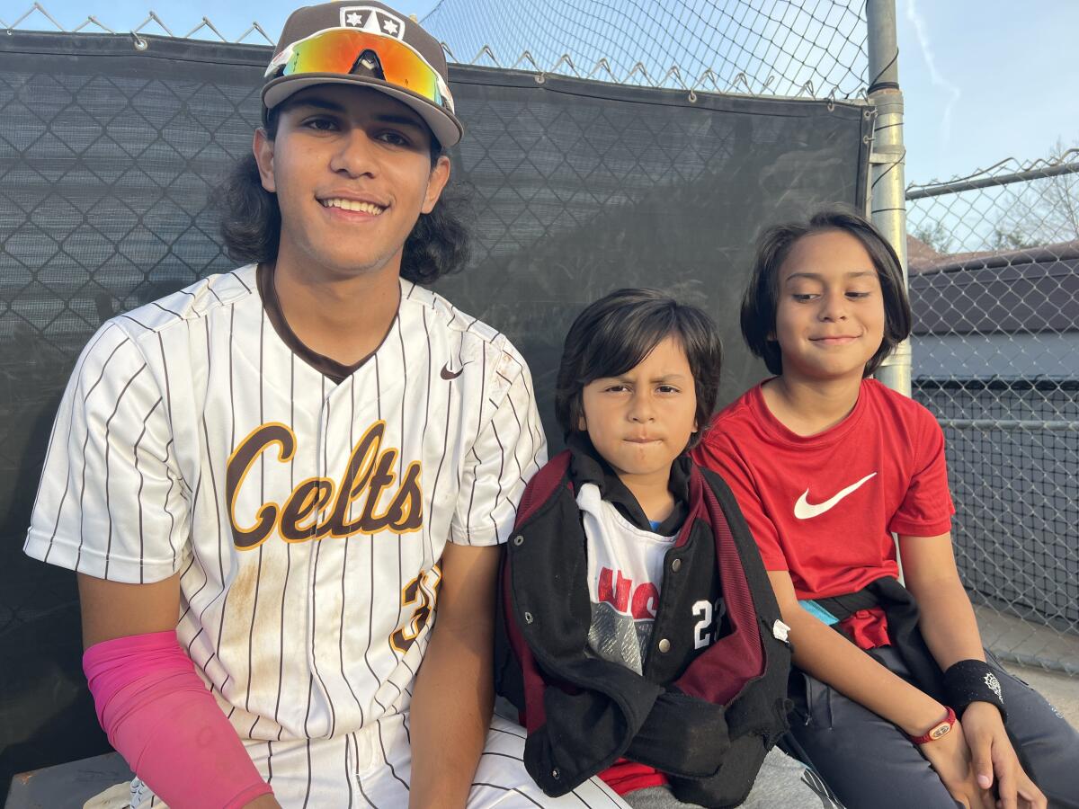 Crespi High pitcher/second baseman Diego Velazquez poses for a photo with brothers Damian, 5, and David, 8.