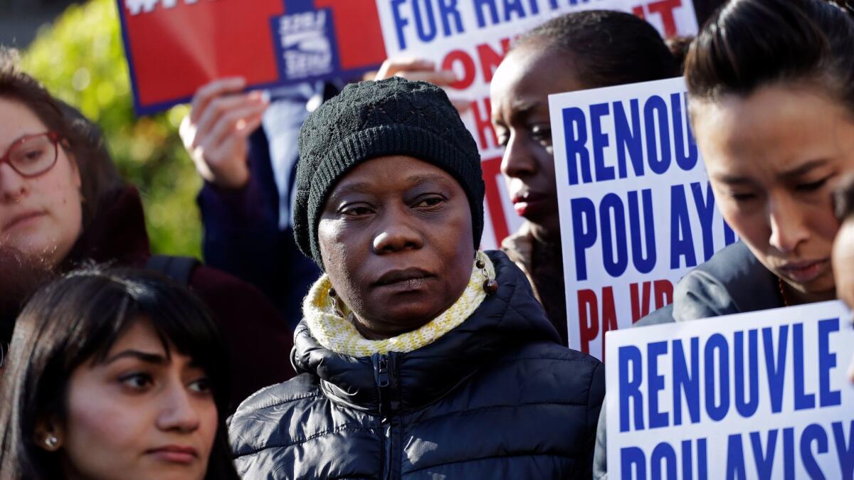 People rally in New York to protest the decision by the Trump administration to end so-called temporary protected status for immigrants from Haiti.
