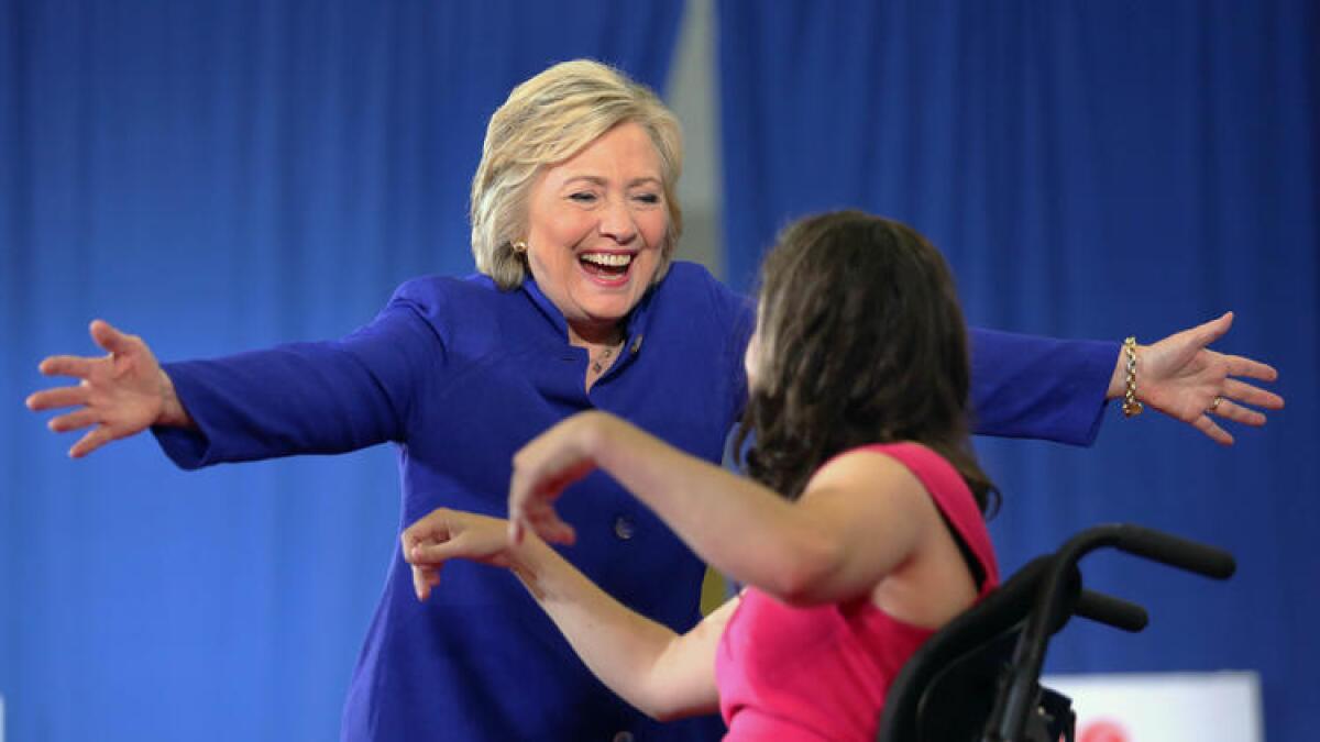 Hillary Clinton greets Anastasia Somoza after Somoza introduced the Democratic presidential nominee at a campaign stop in Orlando, Fla.