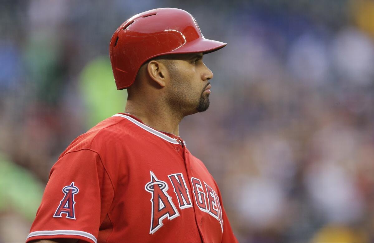 Albert Pujols got his first day off of the season Thursday as the Angels defeated the Seattle Mariners, 7-5, at Safeco Field.