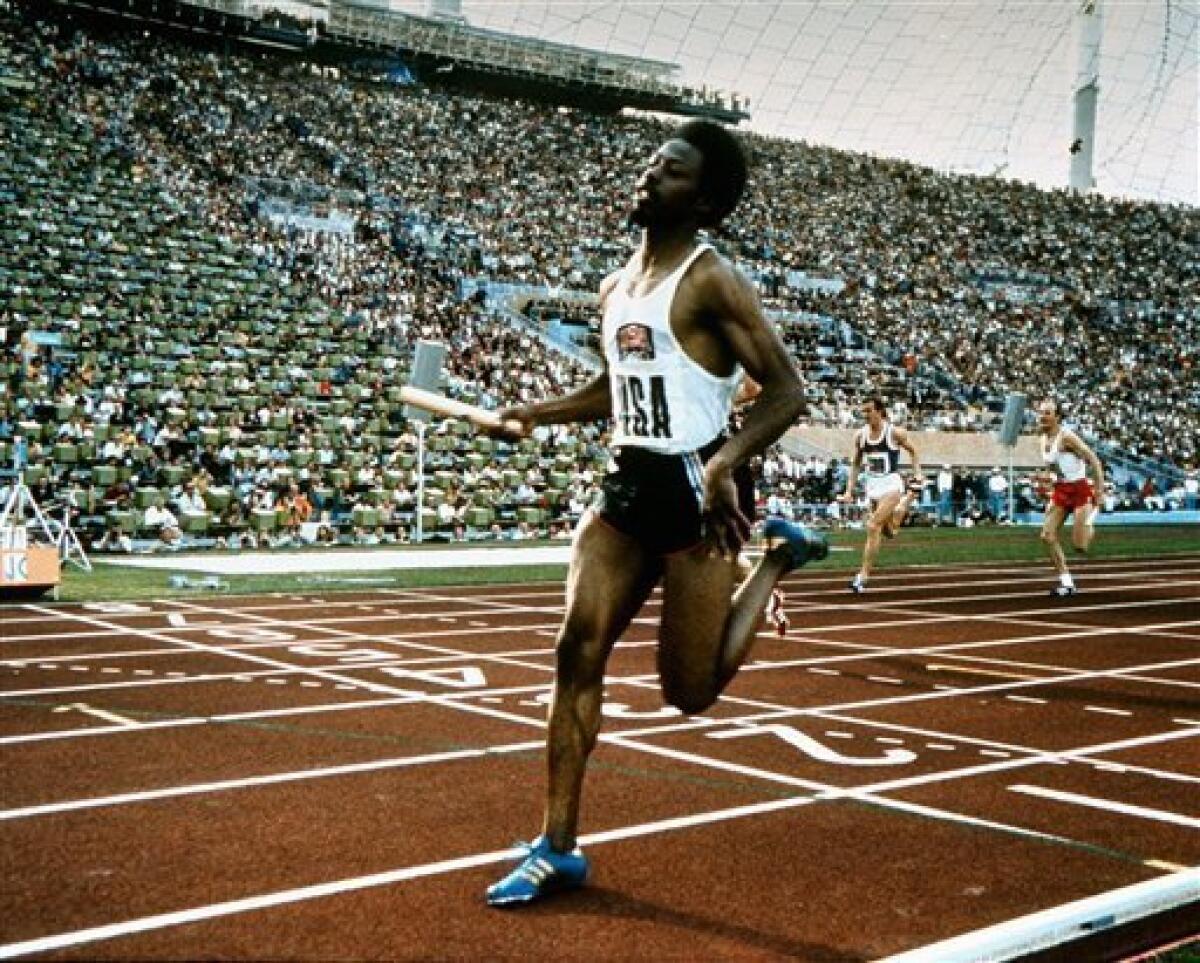 In this Sept. 1972 file photo, Eddie Hart of the United States crosses the finish line to give USA the gold medal in the 4 x100-meter relay at the 1972 Munich Olympics. At the Munich Olympics, Hart was one of the favorites in the most glamorous track and field event, the 100 meters. Only one problem _ his coach had the wrong schedule for the quarterfinal heats, and Hart was disqualified when he didn't show up to the stadium on time. (AP Photo)