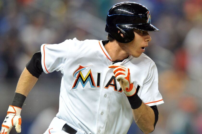 May 21, 2014; Miami, FL, USA; Miami Marlins left fielder Christian Yelich (21) connects for a triple during the sixth inning against the Philadelphia Phillies at Marlins Ballpark. Mandatory Credit: Steve Mitchell-USA TODAY Sports ORG XMIT: USATSI-166682