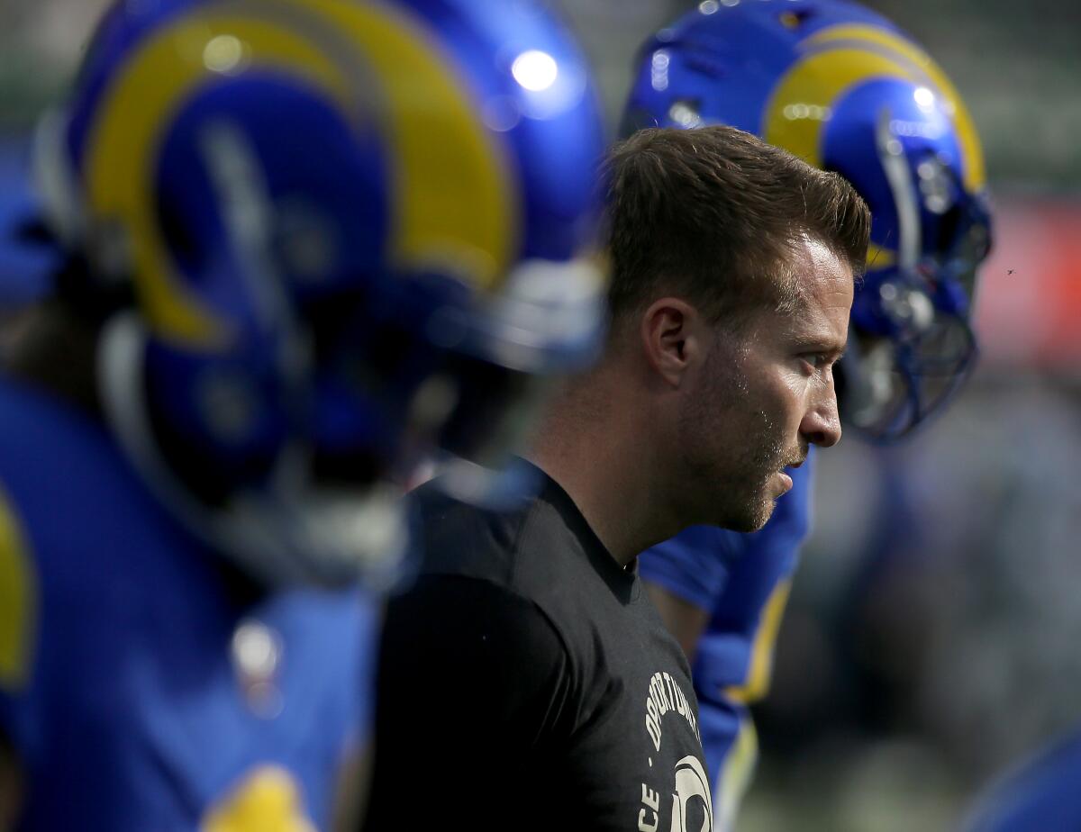 Rams coach Sean McVay watches the Rams warm up before the game against the Broncos on Christmas.