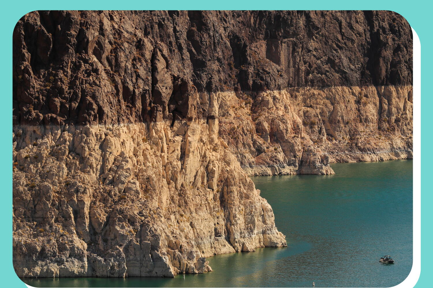 A boater gets an up-close view of the “bathtub ring” on Lake Mead — evidence of its low water level — while touring Hoover Dam.
