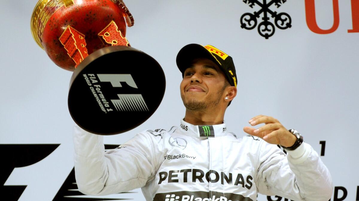 Winner Mercedes' British driver Lewis Hamilton with the trophy on the  News Photo - Getty Images