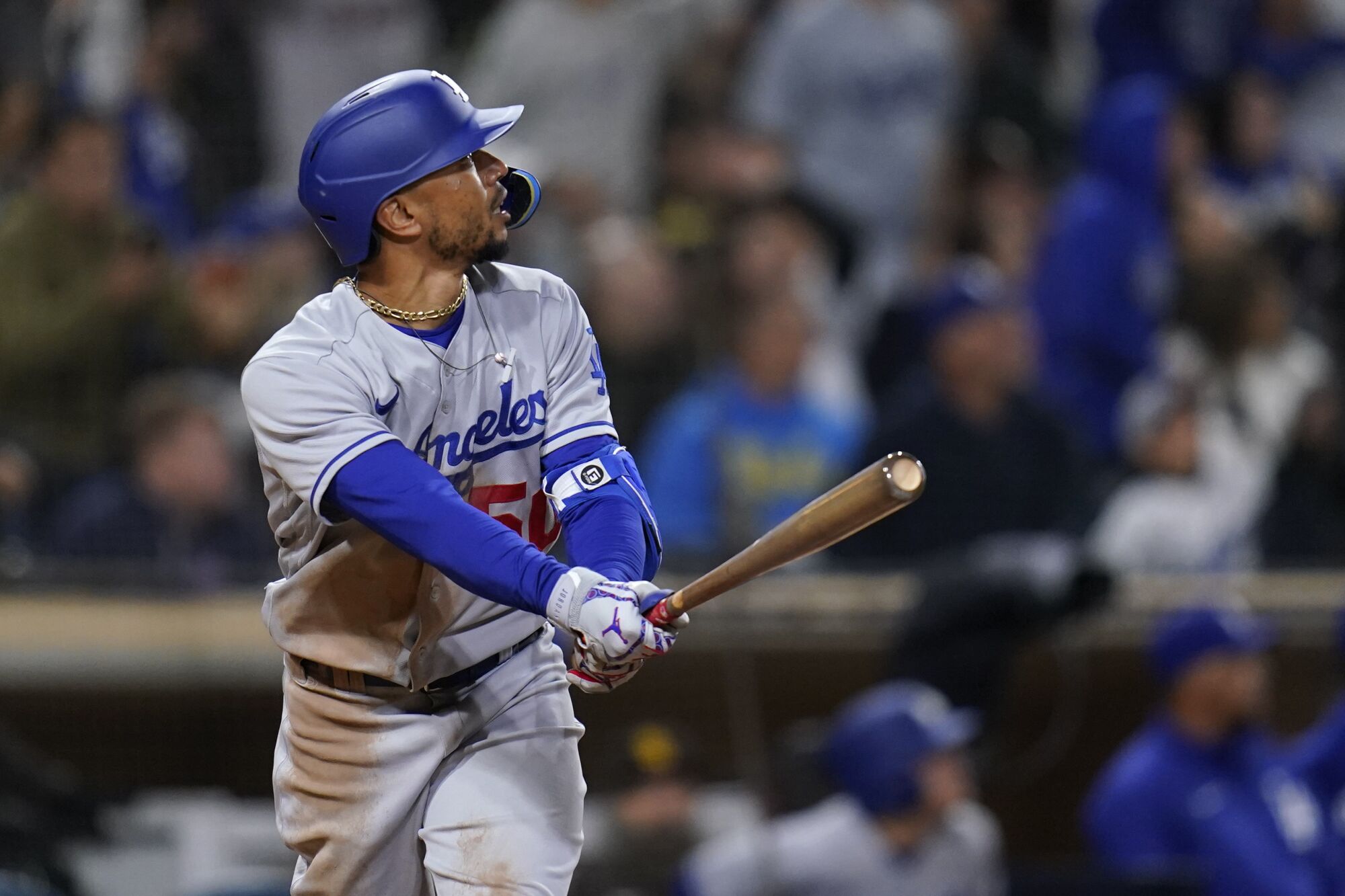 Dodgers right fielder Mookie Betts hits a solo home run during the ninth inning against the San Diego Padres.
