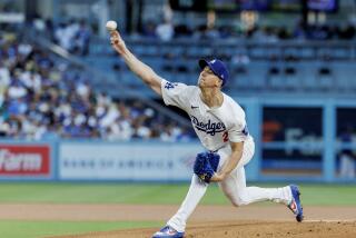 The Dodgers' Walker Buehler pitches against the Seattle Mariners at Dodger Stadium on Tuesday.