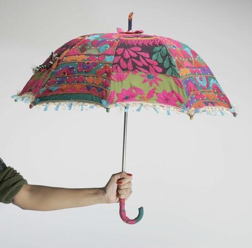 Umbrellas could be thought of as the ultimate accessory. Because they come in all colors and designs, they can easily accent an outfit and keep you dry or shield you from the sun. Pictured here is an embellished umbrella from the Little India area of Artesia.
