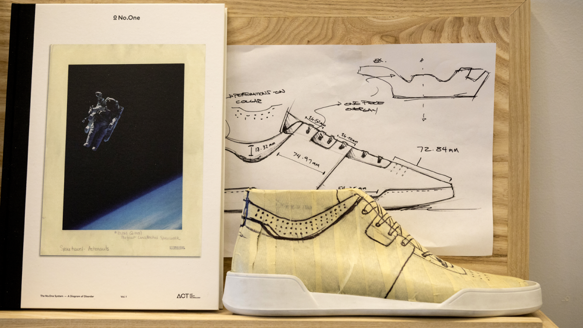A mock-up of a sneaker next to an inspirational book on display at No.One in Venice.