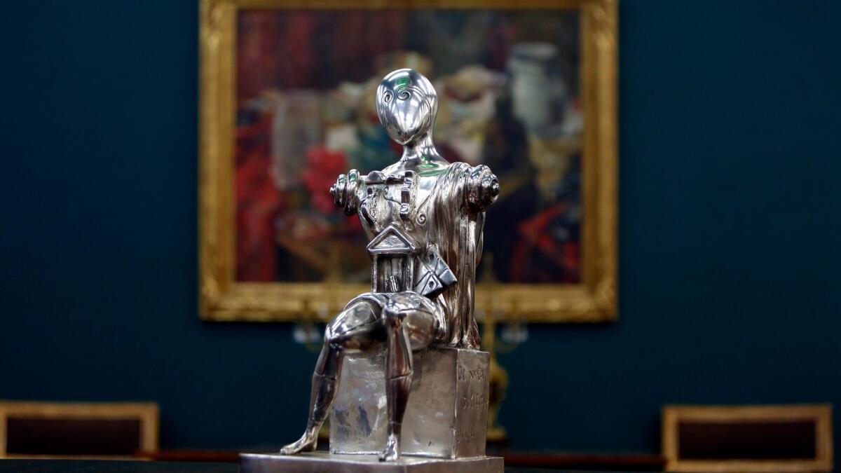 A bronze with silvered patina art piece by Giorgio de Chirico is photographed at Andrew Jones Auctions.