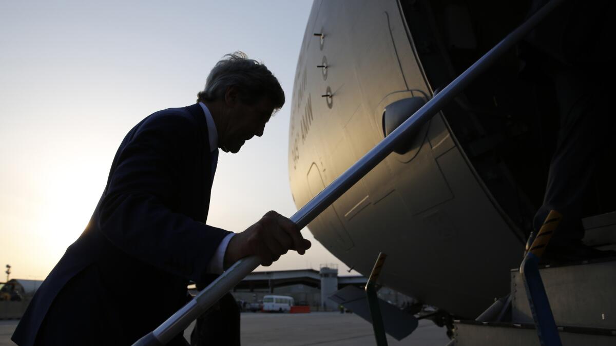 U.S. Secretary of State John Kerry boards his plane at Baghdad's International airport before leaving Iraq on April 8.