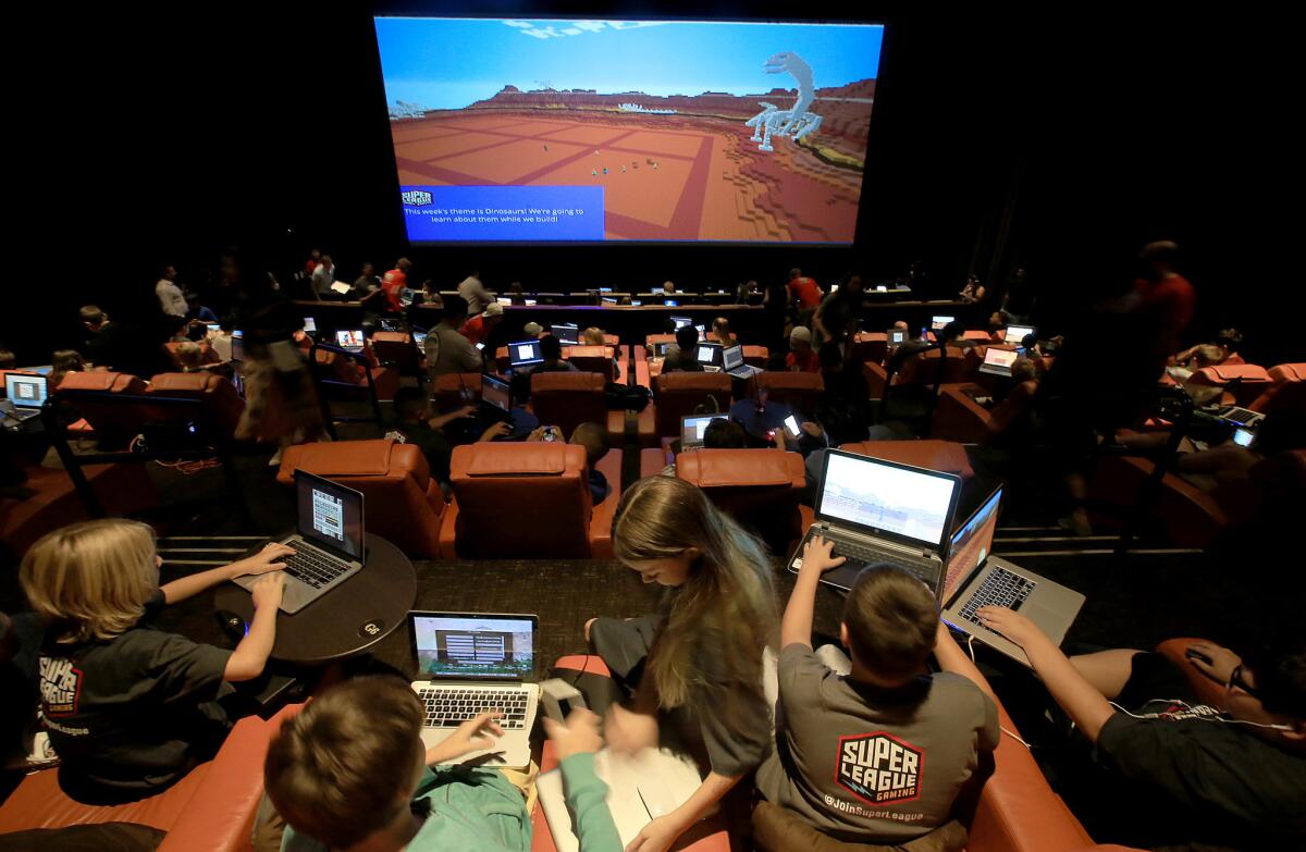 Fans of the computer game "Minecraft" gather at the iPic Theater in Westwood in June for a Super League Gaming event.
