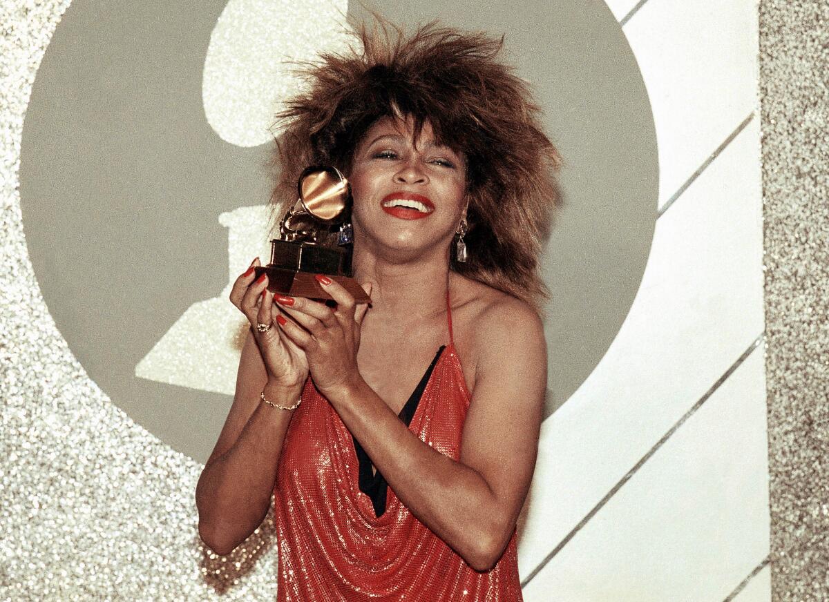FILE - Tina Turner, Pop and R&B vocalist, as holds up a Grammy Award, Feb. 27, 1985, in Los Angeles.  