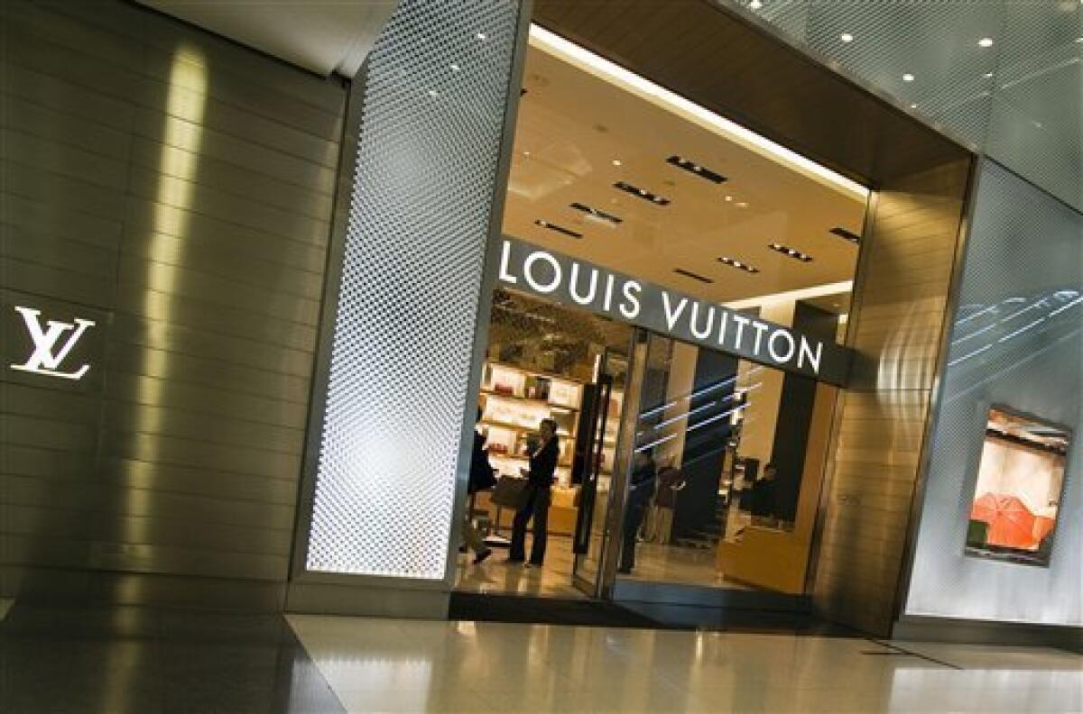 Louis Vuitton owner presses on with plans to upscale brands despite sales  slowdown