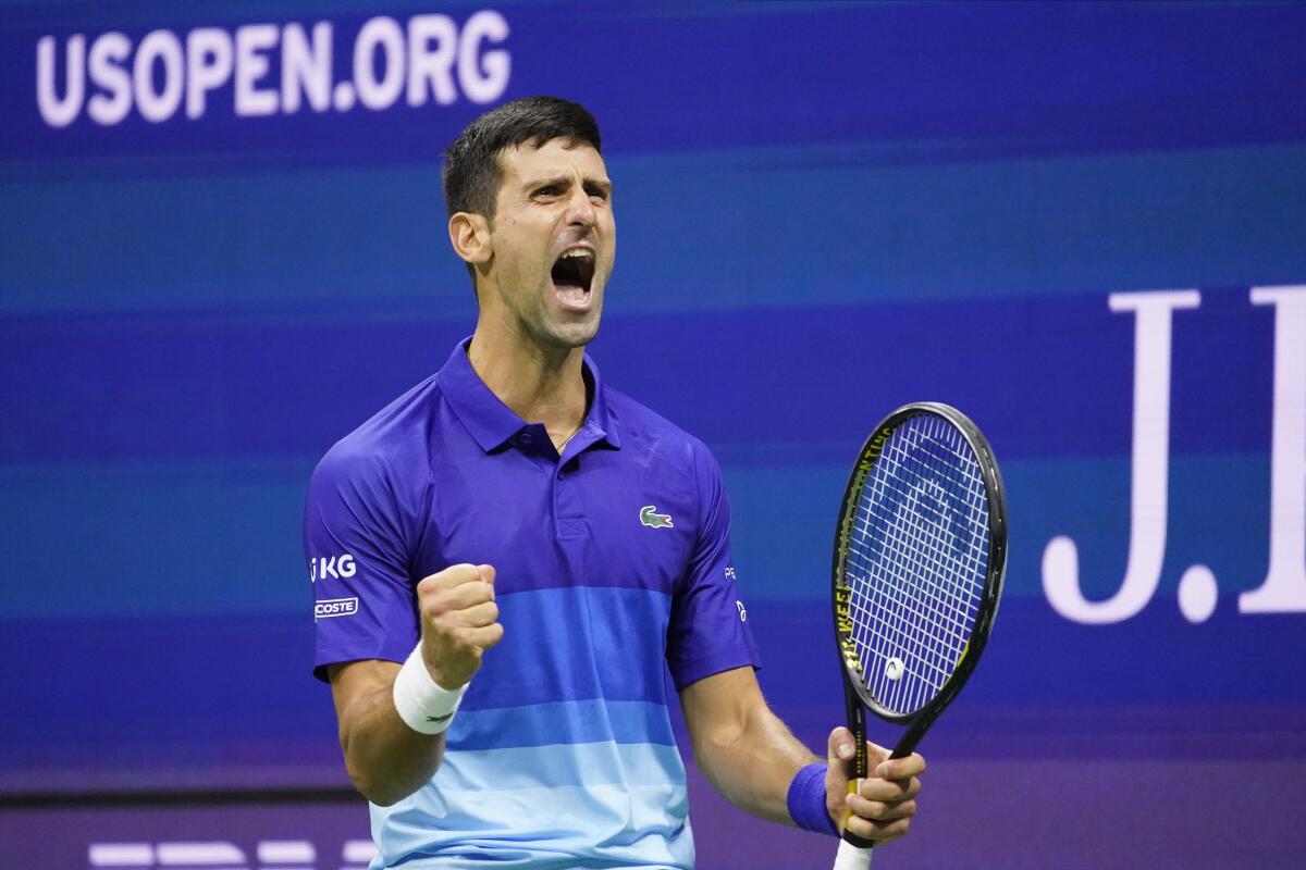 Novak Djokovic reacts after winning a point against Alexander Zverev during their U.S. Open semifinal Friday night.