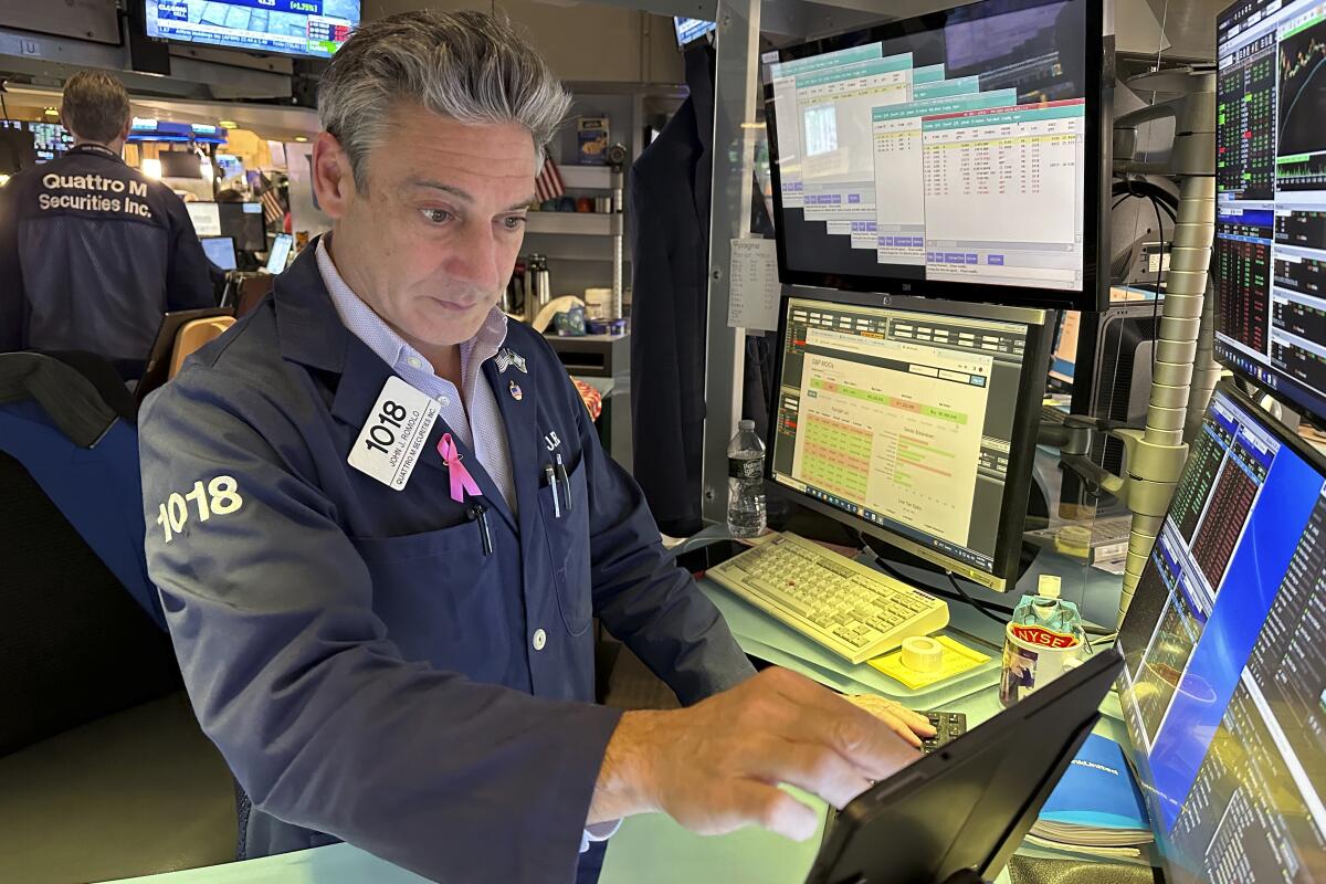 Traders work on the New York Stock Exchange floor 