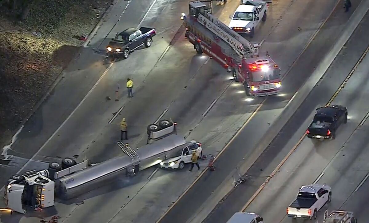 Southbound lanes of the 5 Freeway were closed in Boyle Heights on Tuesday morning after a milk tanker overturned 