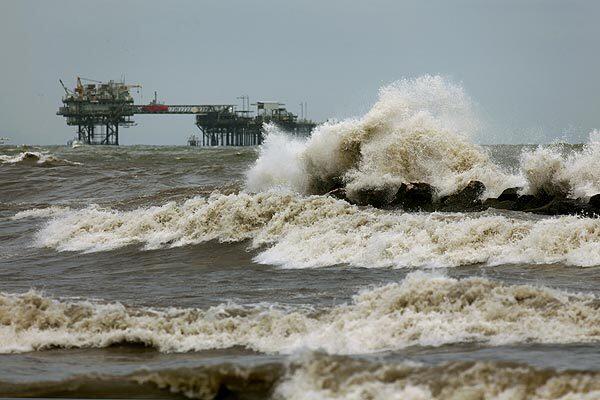 Tropical storm Alex sends 4- to 6-foot swells crashing onto the coastline in Port Fourchon, La. The high surf is hindering oil spill cleanup efforts.