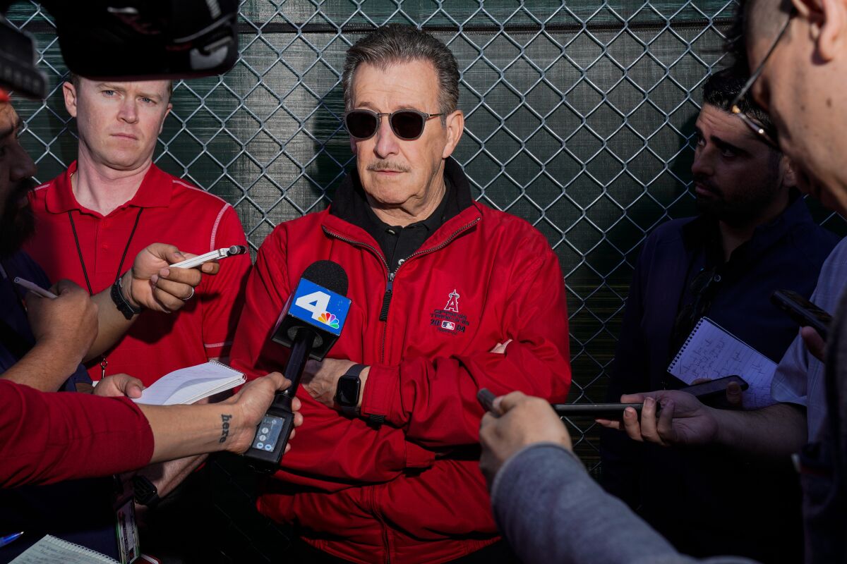 Angels owner Arte Moreno, speaks with reporters on the first full squad workout day 