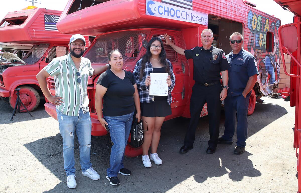 Costa Mesa Councilman Manuel Chavez, Angelica Flores and Emily Agulaira with Dan Stefano and Southside Towing's Dave Padua .