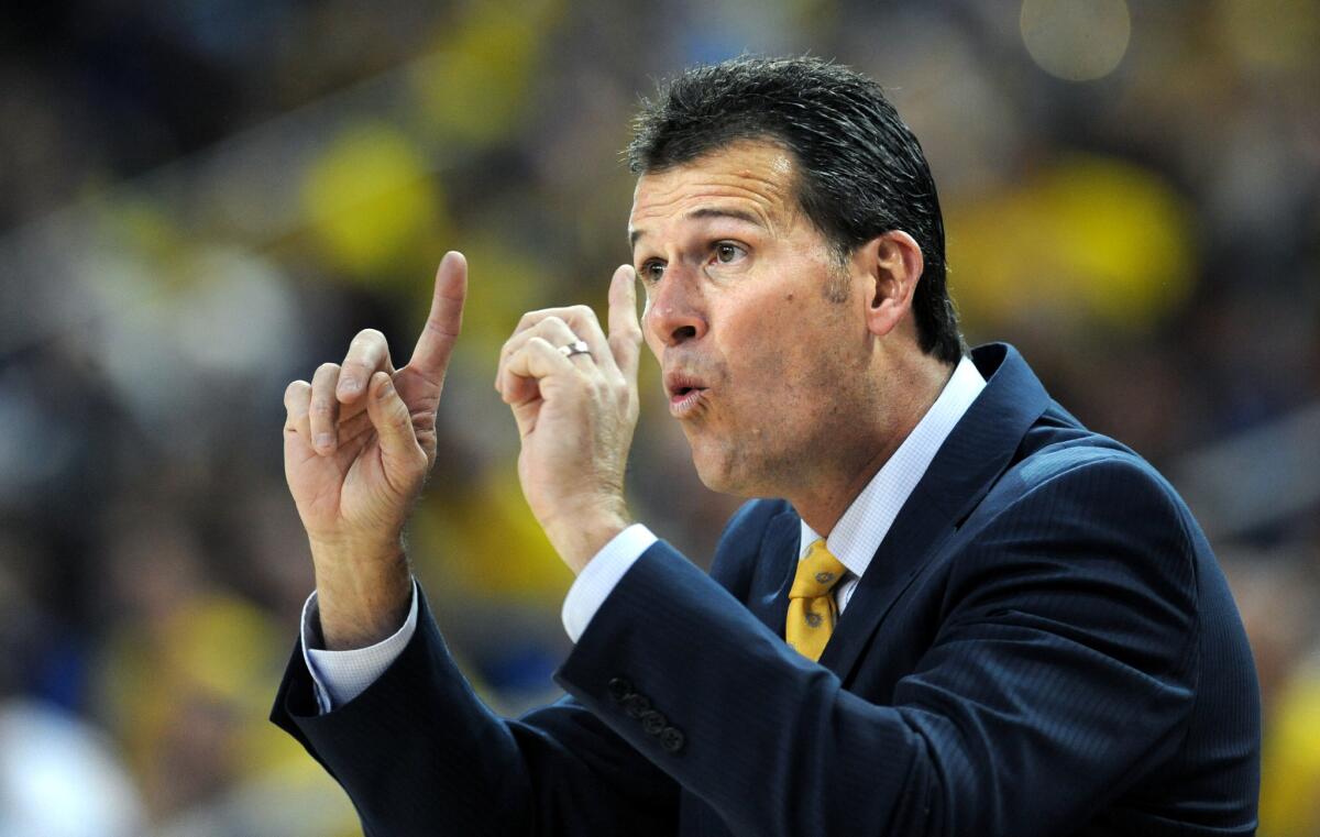 UCLA Coach Steve Alford instructs his players during a game against Kentucky at Pauley Pavillion.