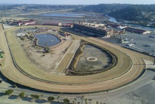 View looking to the east with the horse race track in the foreground at the Del Mar fairgrounds on Monday, January 14, 2020.