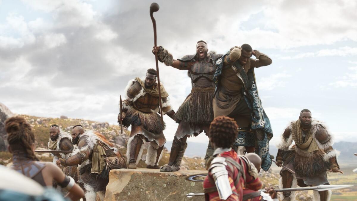 M'Baku (Winston Duke), at center, in a fight scene from "Black Panther."