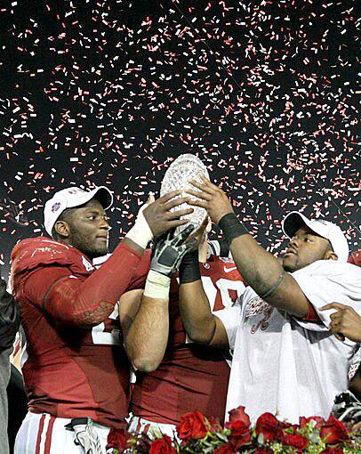 Alabama linebacker Rolando McClain and running back Mark Ingram hoist the BCS championship trophy after the Crimson Tide defeated the Texas Longhorns, 37-21, on Thursday night at the Rose Bowl.