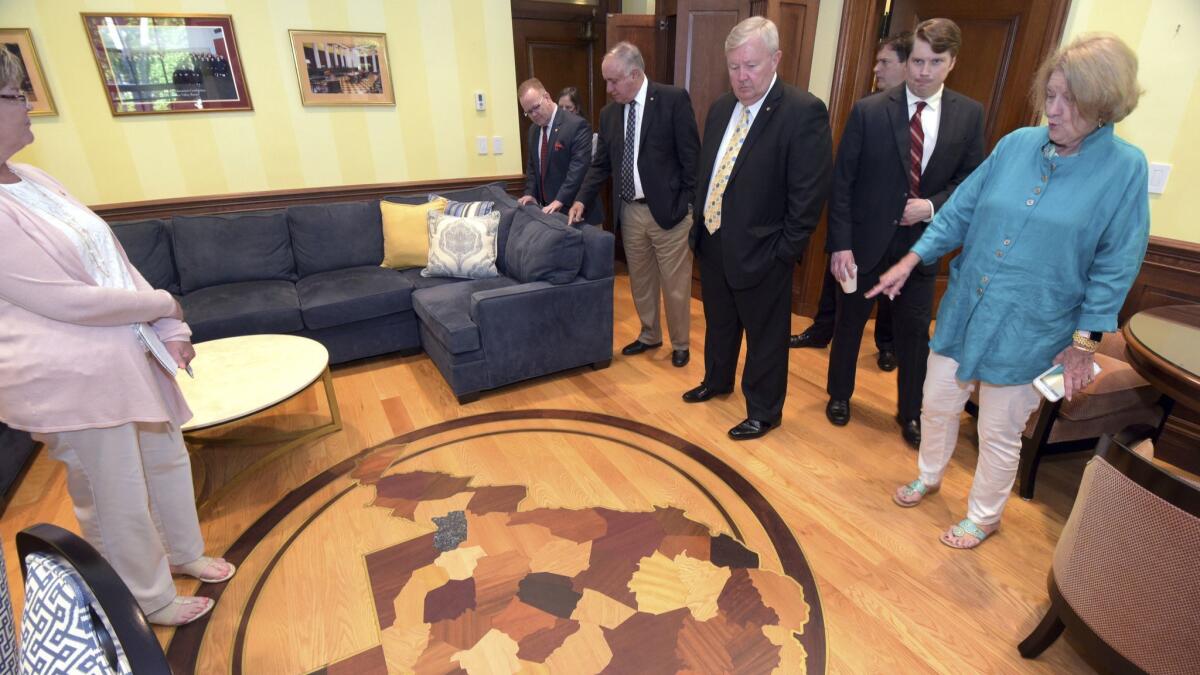 Members of the West Virginia House Judiciary Committee examined a $7,500 floor map in the office of Justice Allen Loughry earlier this month.