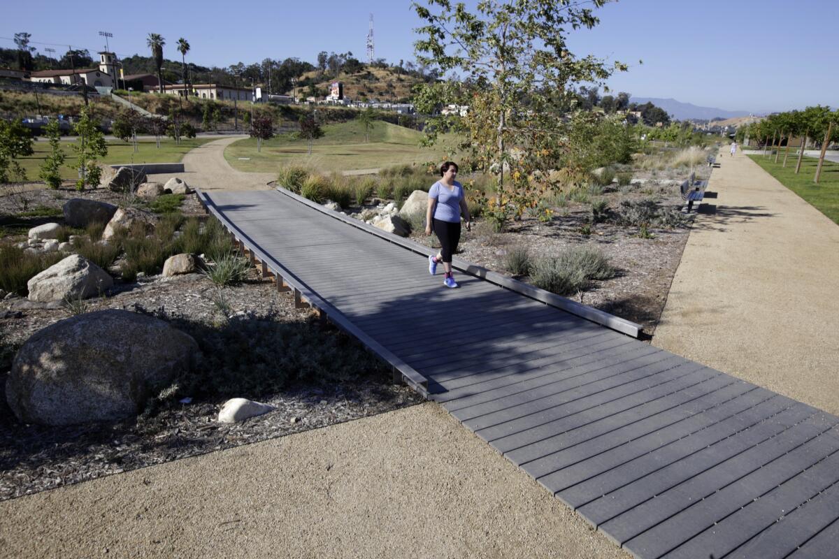 A wooden bridge over an arroyo at Los Angeles State Historic Park.