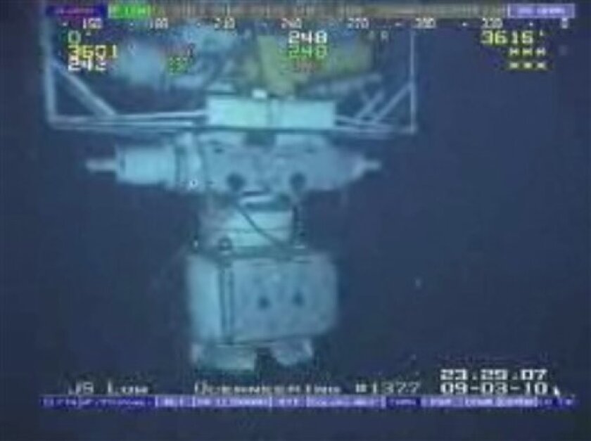 In this image taken from video provided by BP PLC at 12:23 a.m. EDT, Saturday Sept. 4, 2010 Aug. 3, 2010 shows the blowout preventer that failed to stop oil from spewing into the Gulf of Mexico being raised to the surface. The blowout preventer wasn't expected to reach the surface until Saturday, at which point government investigators will take possession of it. (AP Photo/BP PLC) NO SALES