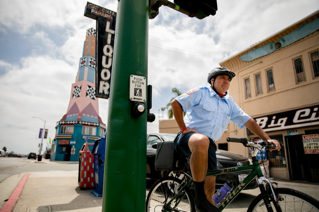 Christopher Castor, 56, who pilots the number 7 bus that traverses University Avenue, rides his bike to work.