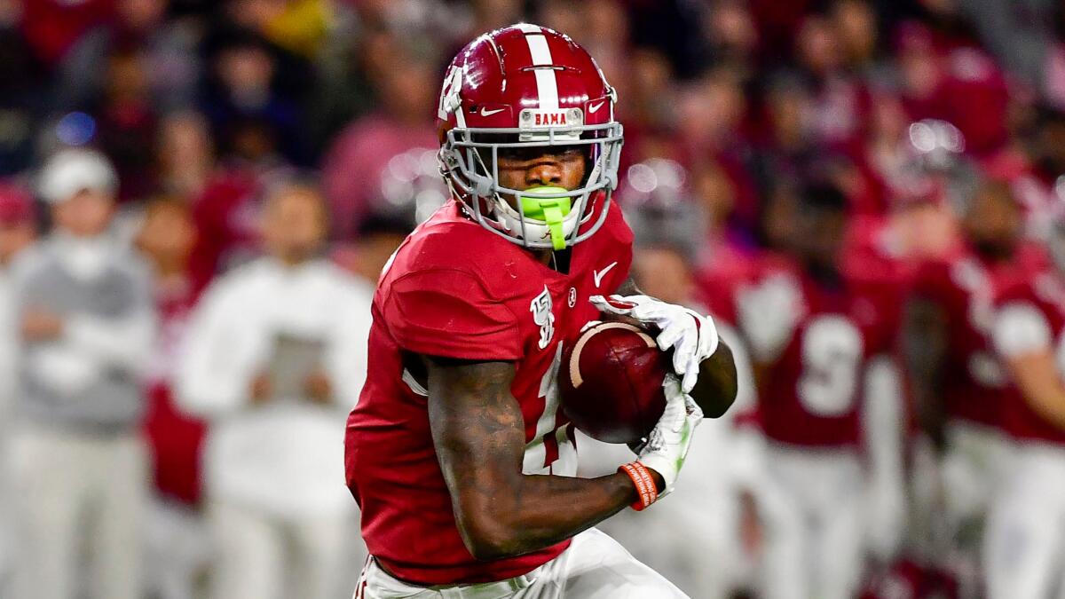 Alabama receiver Henry Ruggs III runs after a catch.