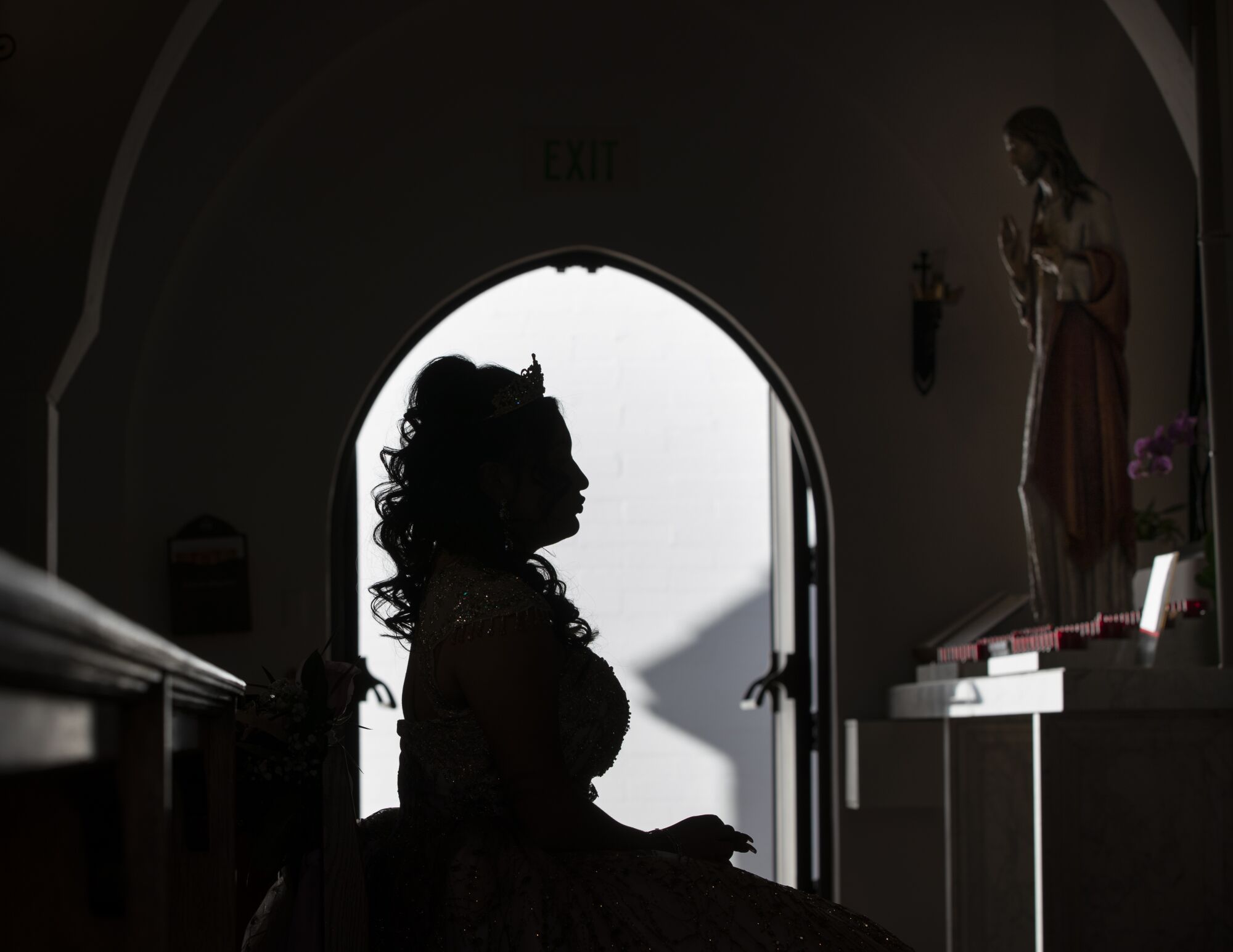 Joanna Guzman has Mass at Mary Star of the Sea before her Quinceanera on Saturday, Nov. 19.