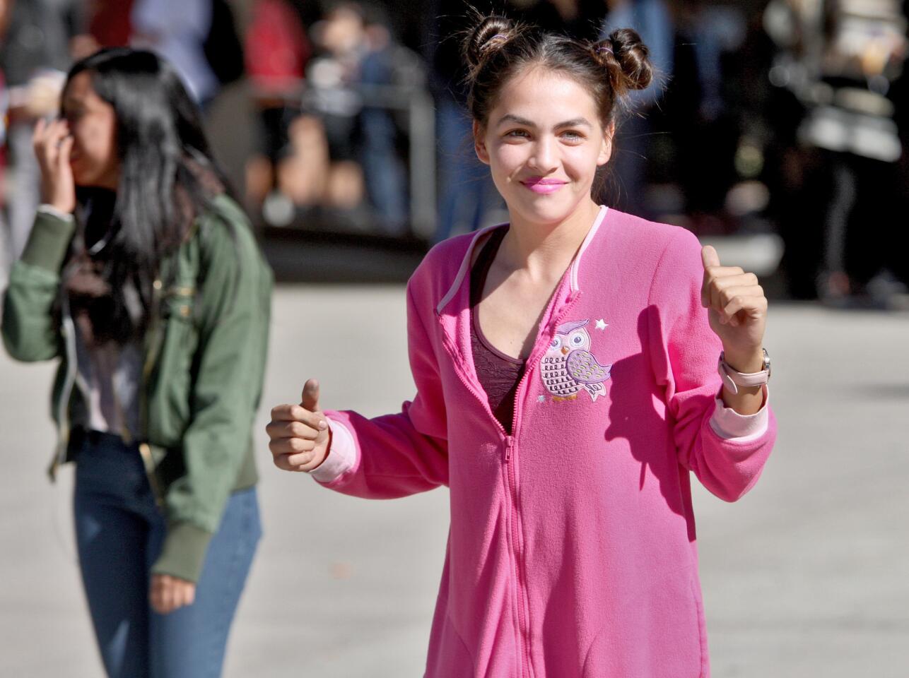 As part of Spirit Week, junior Valeria Hidalgo dances while wearing her pink pajamas during Pajama Day at Glendale High School in Glendale on Thursday, November 5, 2015.