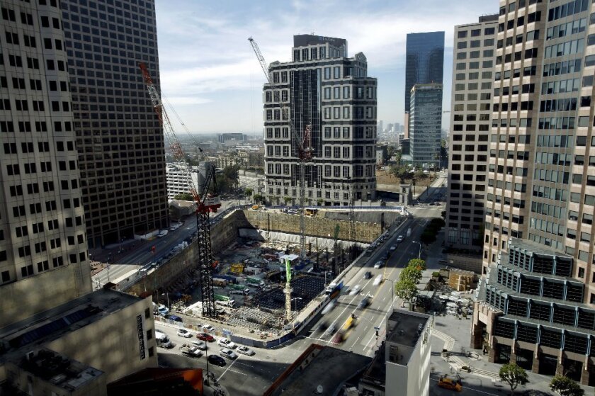 Workers will attempt a world record Saturday by continuously pouring about 21,200 cubic yards of concrete as part of the Wilshire Grand Project at the intersection of Figueroa Avenue and Wilshire Boulevard.