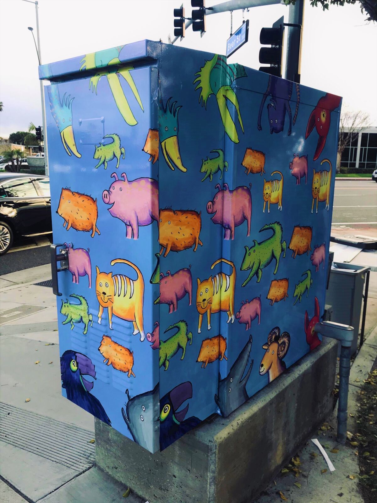 A utility box art wrap created by Bonnie Matthews in 2020 stands at the corner of Bear and Bristol streets in Costa Mesa.